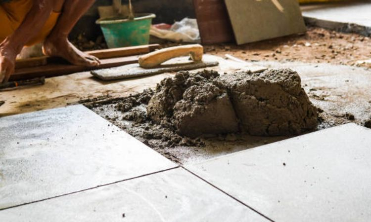 Lát gạch nền cần bao nhiêu xi măng?
